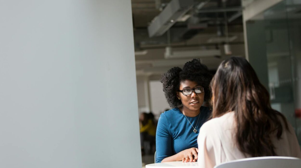 Woman Wearing Blue Top Beside Table